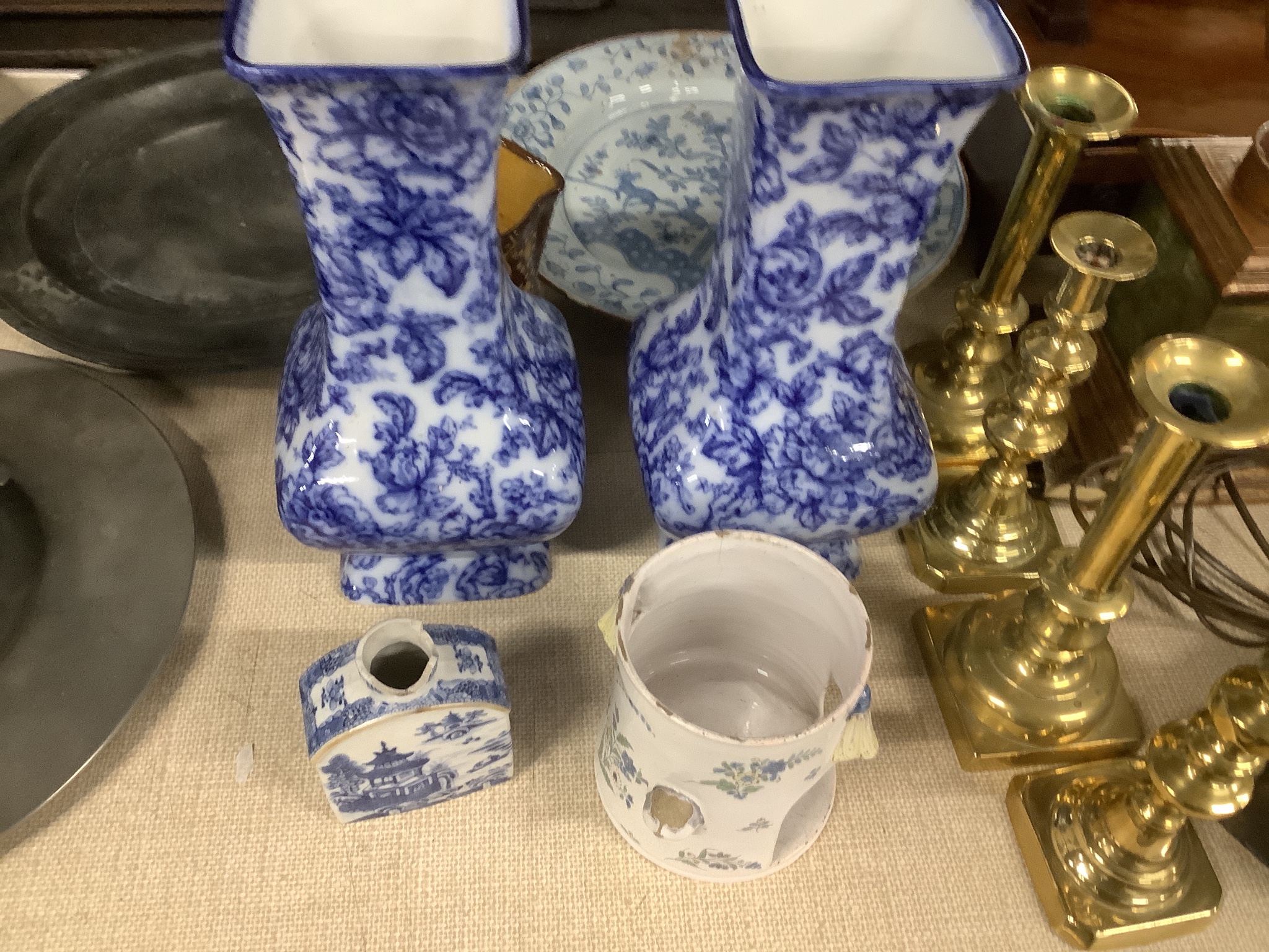 A pair of Losol ware blue and white vases, a slipware jug, a faience candle holder and a Chinese tea canister (without cover), vases 33cm high